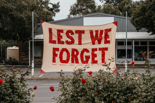 Anzac Day banner made from little poppies in rural town.