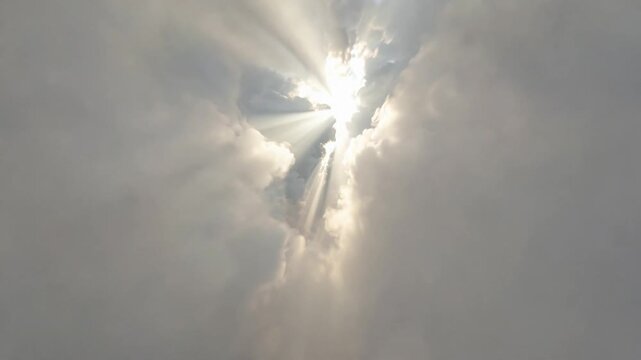 Drone POV Flying Through Heavy Fast Moving Fog Walls With Dramatic Crepuscular Sun Rays Background