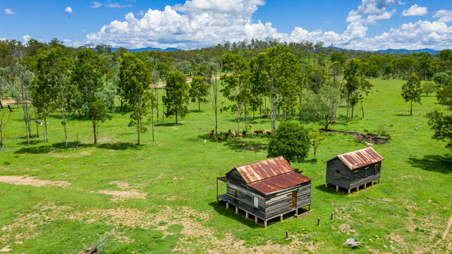Kroombit Tops National Park summer landscape with disused homestead and vibrant green vegetation