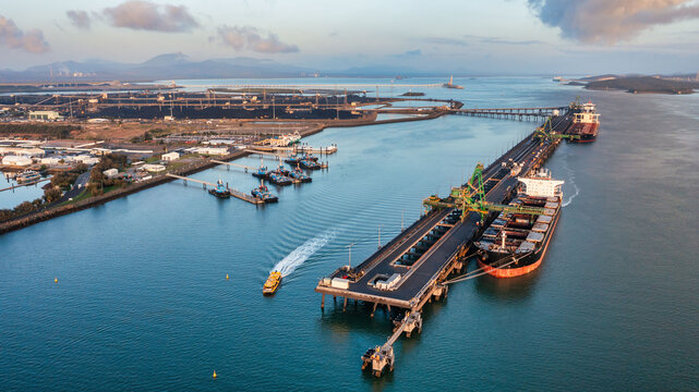 RG Tanna coal ship and wharf with coal piles in the background
