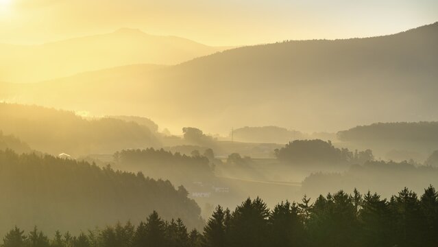 Landscape with forest, meadows and mountains around the town of Bad K&ouml;tzting, with a part of the Kaitersberg in the background on the right. In the morning at sunrise. District of Cham, Upper Palatinate, Bavarian Forest, Bavaria, Germany