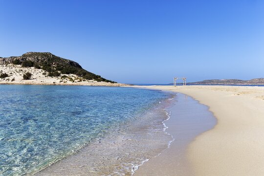 Crystal clear turquoise water, deserted dream beach in spring, Simos beach, Sarakiniko beach, coastline, Elafonisos, Deer Island, Laconia, Peloponnese, Ionian Islands, Ionian Sea, Greece