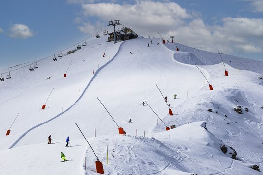 Skiers in the ski area at the summit of Corne de Sorebois, Val d'Anniviers, Valais Alps, Canton Valais, Switzerland