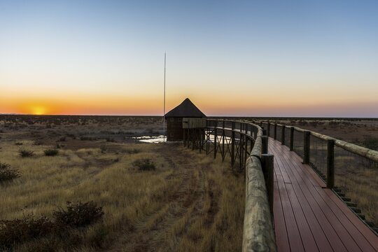 Animal viewing plattform in Olifantsrus at sunset, Etosha National Park, Namibia