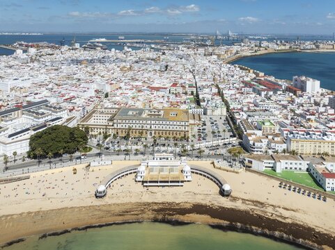 The town of C&aacute;diz with the old quarter in the foreground. Prominent the Caleta beach and the old Balneario de la Palma. Aerial view. Drone shot. C&aacute;diz province, Andalusia, Spain