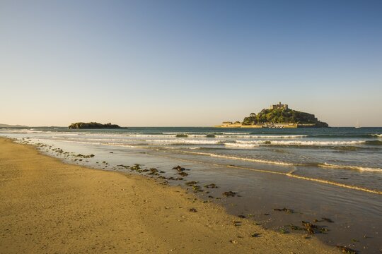 Sand beach with the island of St. Michael's Mount at high tide, Marazion, Cornwall, England, United Kingdom