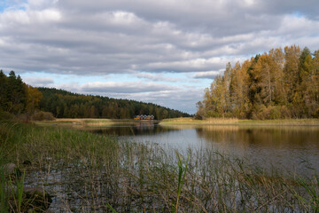 Fototapeta premium View from the shore of Lake Ladoga in the Ladoga Skerries National Park, near the village of Lumivaara, on a sunny autumn day, Republic of Karelia, Russia
