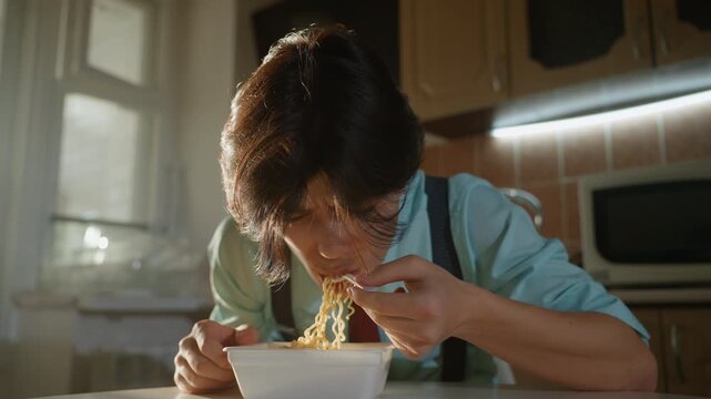 Man slurping noodles with playful energy. Sunlit kitchen scene, shirt tie and suspenders, noodle strands midair, steam and sauce flecks, candid joyful meal, messy comfort food vibe, upbeat lunchtime