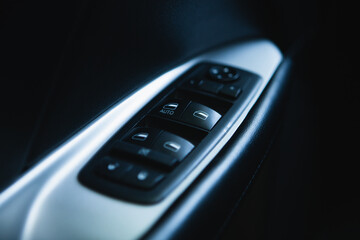 Obraz premium Close up of a door handle in a modern car. Selective focus.