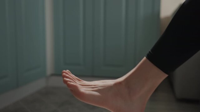Fashionable way to wear socks. Gracefully placing decorated socks onto toes without noise or fuss. Smoothly and silently sliding stylish patterned socks over toes with elegance and finesse