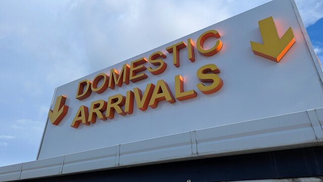 Domestic arrivals sign at airport terminal in Nadi on tropical island of Viti Levu in Fiji