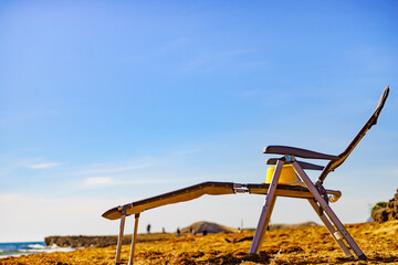 Fototapeta premium Deckchair on sandy beach