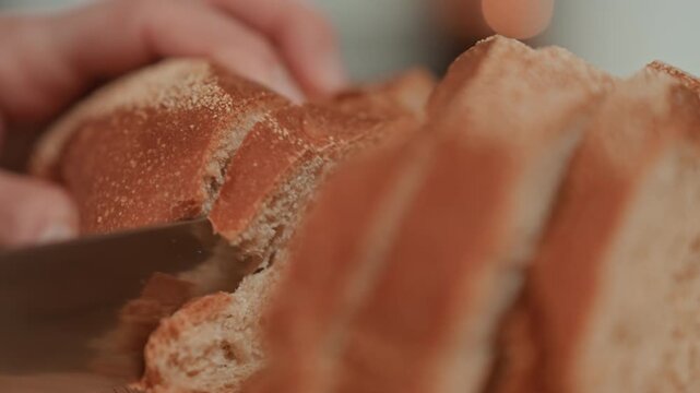 Loaf slice hands tearing crumb on wooden board, soft interior and crisp crust revealed by gentle fingers, warm homemade atmosphere evokes slow morning comfort and subtle musical mood for quiet