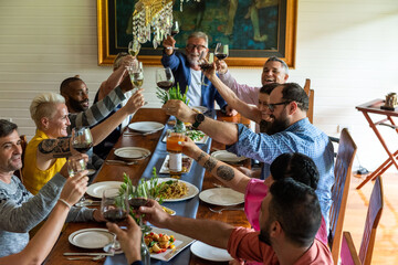 Fototapeta premium Joyful diverse group dining photo