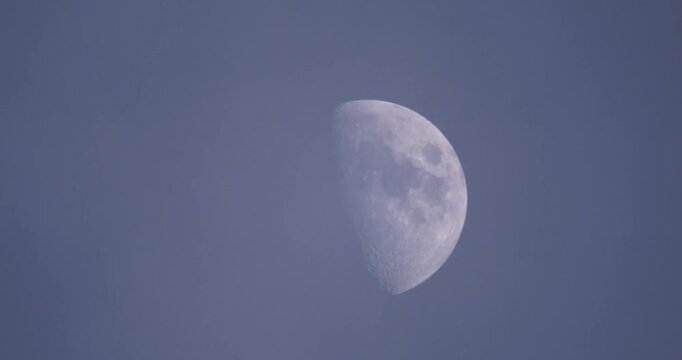Calm Celestial Scene Showcasing Detailed Moon Against Twilight Backdrop