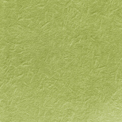 Obraz premium Textured green paper background with a crumpled, organic appearance.