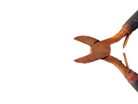 Rusty vintage side cutters lying on a transparent background, highlighting metal oxidation