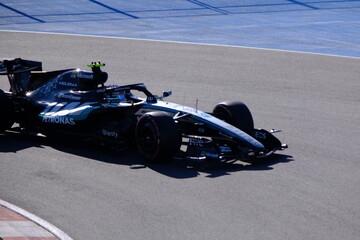 Obraz premium May 24, 2026, Montreal, Canada, Mercedes F1 car racing through Circuit Gilles Villeneuve corner. g.