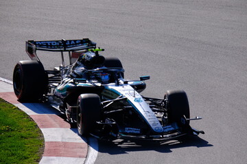 Obraz premium May 24, 2026, Montreal, Canada, Mercedes F1 car racing through Circuit Gilles Villeneuve corner. g.