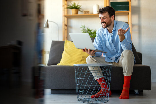 Business man working on laptop at home office. Remote teacher, remote studying, virtual training.
