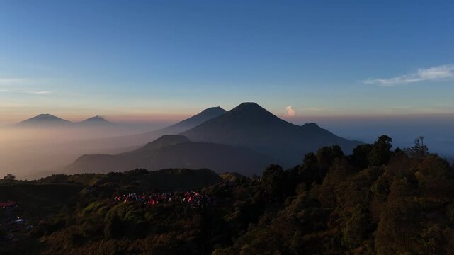 Aerial footage of Mount Sumbing and Sindoro from the top of Mount Prau.