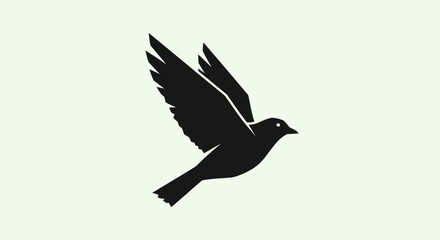 Obraz premium Black bird silhouette flying against a light background, freedom, hope, peace, nature