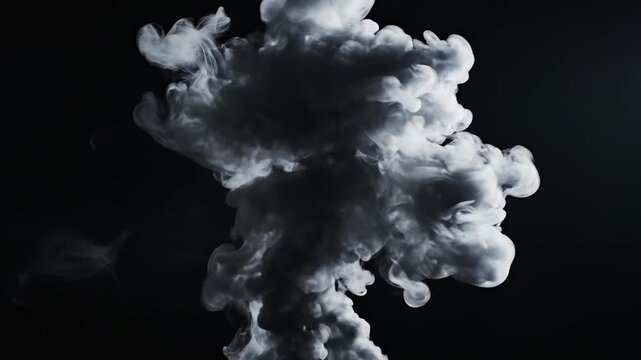 Explosion of white smoke or powder in slow motion against a dark background, dramatic atmospheric effect, abstract energy