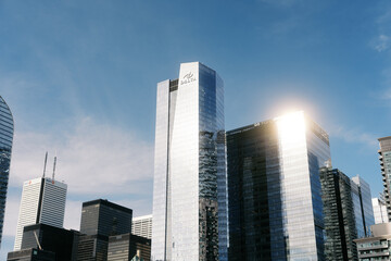 Obraz premium Toronto, Canada - May 26, 2026: Modern glass skyscrapers and Delta Hotel tower in downtown financial district
