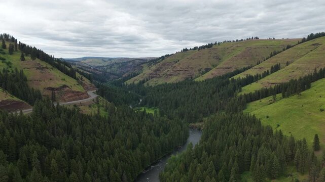 Aerial of Oregon State highway 82 and hillsides along Minam river in spring