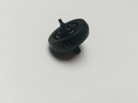 Black plastic mouse scroll wheel macro shot. Universal computer hardware repair component