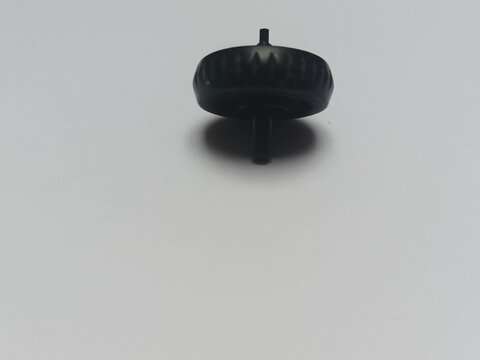 Black plastic mouse scroll wheel macro shot. Universal computer hardware repair component