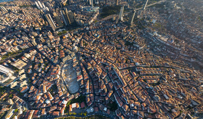 Obraz premium Istanbul, Turkey. Panoramic aerial drone view of European city center skyline with modern skyscrapers at sunset, clear sky, urban landscape. Aerial view