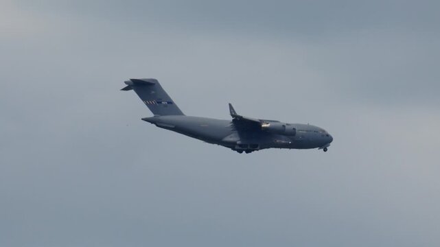 C-17 Globemaster transports military cargo during strategic airlift operations over the airspace
