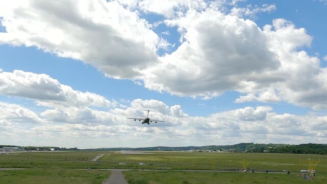 C-17 Globemaster performs landing maneuver at military airbase with strategic airlift capabilities