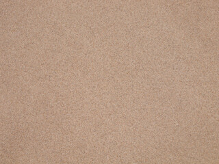 Seamless natural beach sand texture background for summer designs © Adam