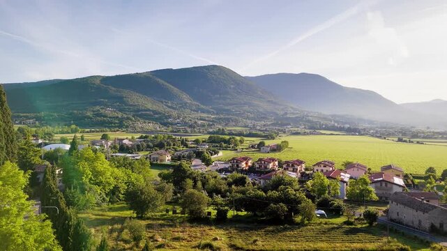 Rural settlement and agricultural fields in Costermano sul Garda area with vineyard landscape and hills, aerial view, Italy