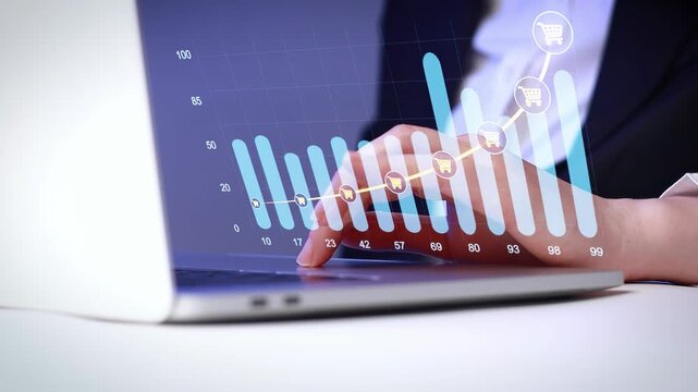 Business person analyzes online shopping data with graphs on laptop screen during work hours.