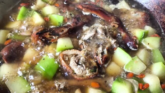 Boiling roasted duck with wax gourd in pot, indoor Chiangmai Thailand.