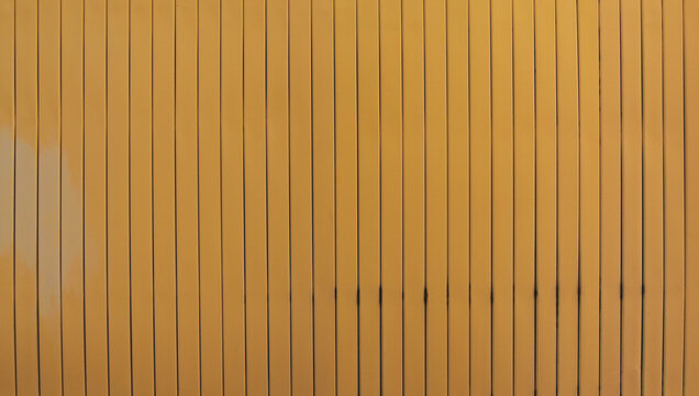 Abstract background of weathered yellow metal vertical panels or blinds