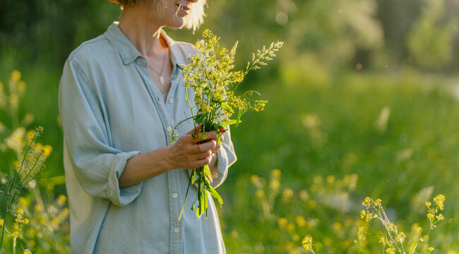 Pure harmony and self-care. Mature blonde woman enjoying a peaceful summer day.