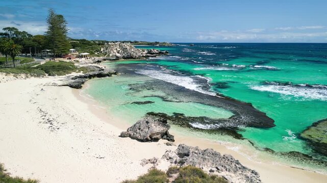 noramic aerial view of Rottnest Island coastline showing clear waters and pristine beach in sunlight