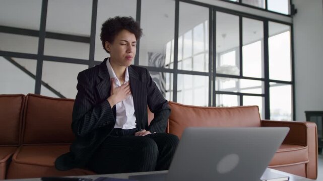 Entrepreneur suffering heartburn while working