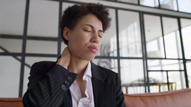 Entrepreneur suffering upper back pain at work
