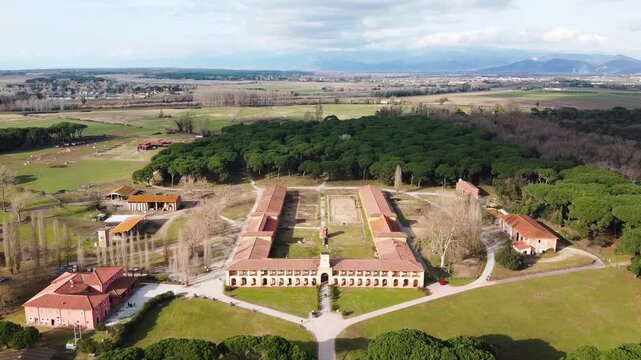 Aerial view of San Rossore Natural Park in Pisa, Italy, with lush greenery and coastline