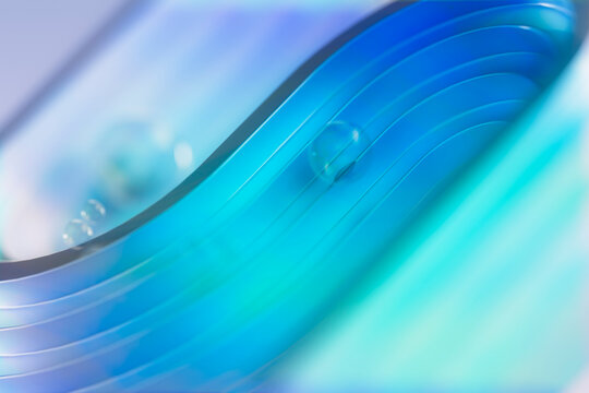 3D turquoise wave line with droplet on glossy channel