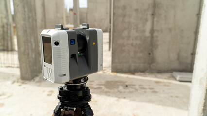 Surveying device mounted on tripod stands ready © I