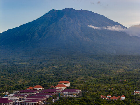 Scenic evening view of Mount Agung volcano and buildings in Bali