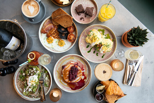 Delicious Brunch Spread Featuring Various Dishes and Beverages in a Cozy Setting