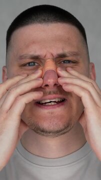 A man with a broken nose and a bandage on the bridge.
Deviated septum.
Face, medical bandage, rhinoplasty, plastic surgery