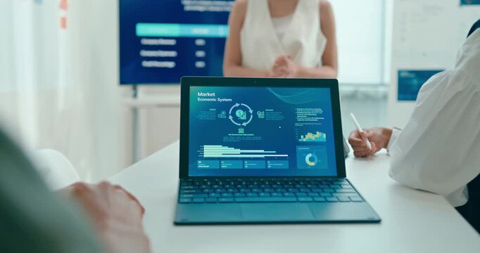 Closeup group Asian businesspeople work together discuss plan idea with investment profit sale statistics in business meeting in office. Financial generation z team brainstorm on e-Commerce project.